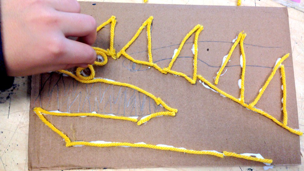 2nd graders begin to make dragon or monkey prints for the Chinese New Year- the year of the monkey!