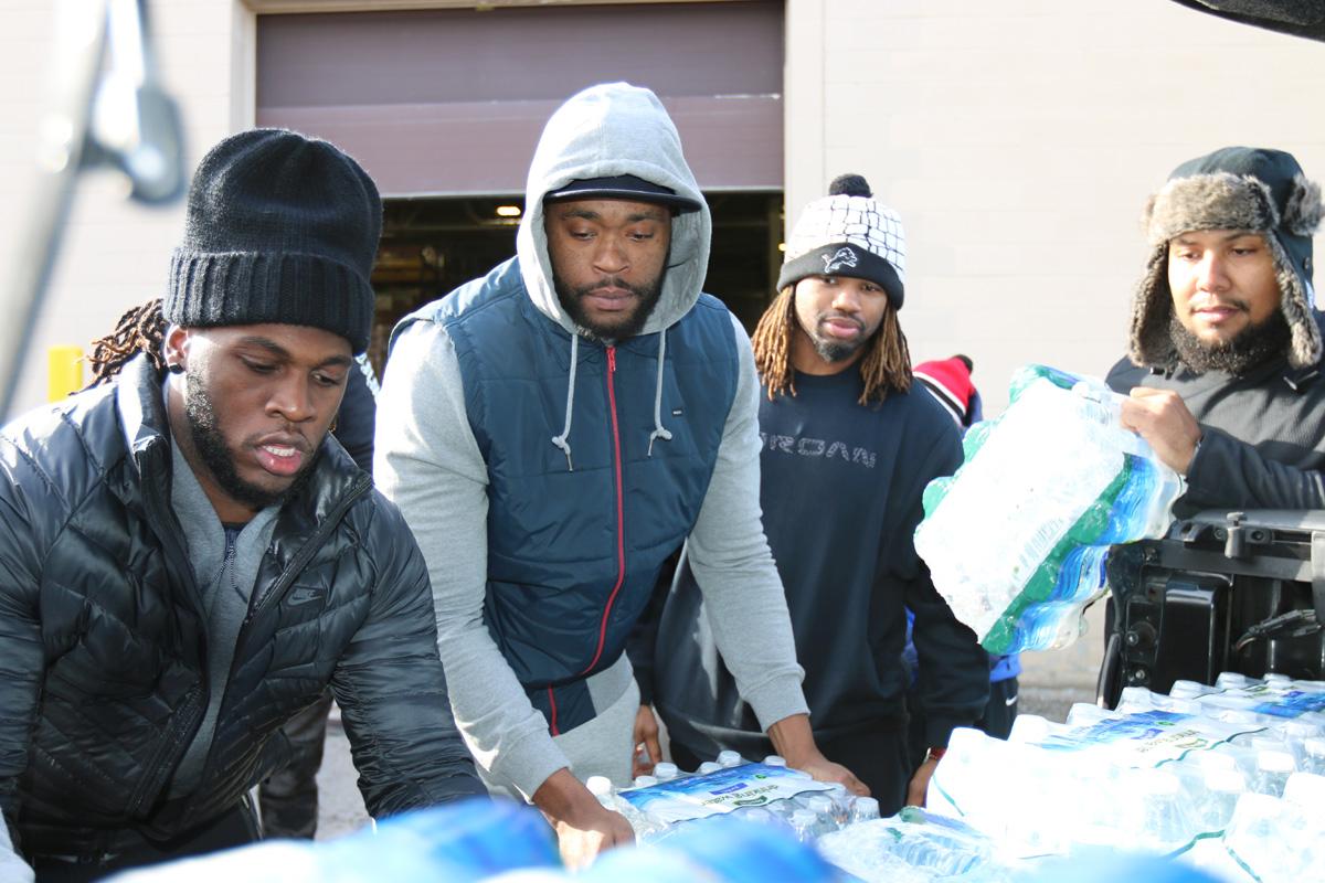 Lions's tweet photo. Photos of @Ziggy_Ansah &amp; #Lions teammates donating bottled water in Flint: https://t.co/rFVQE6sswb https://t.co/02U5zYKn0a