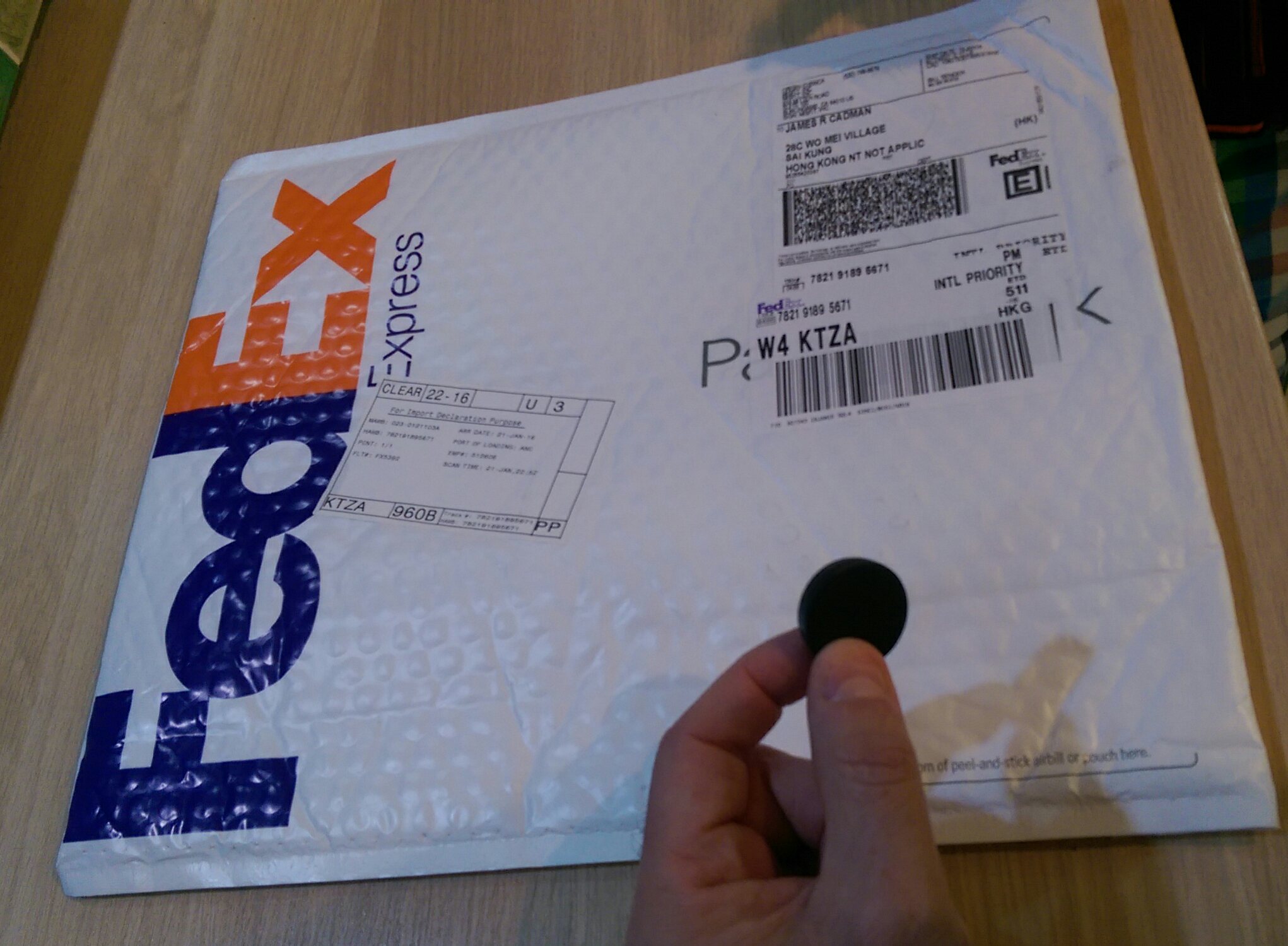 Fedex envelope with outlet pouch