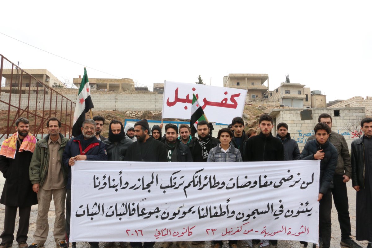 RaedFares4's tweet photo. We aren't gonna negotiate while daily massacres,our sons are detonated &amp; our children re starving 
#Syria #Kafranbel https://t.co/7ODU4Lputp