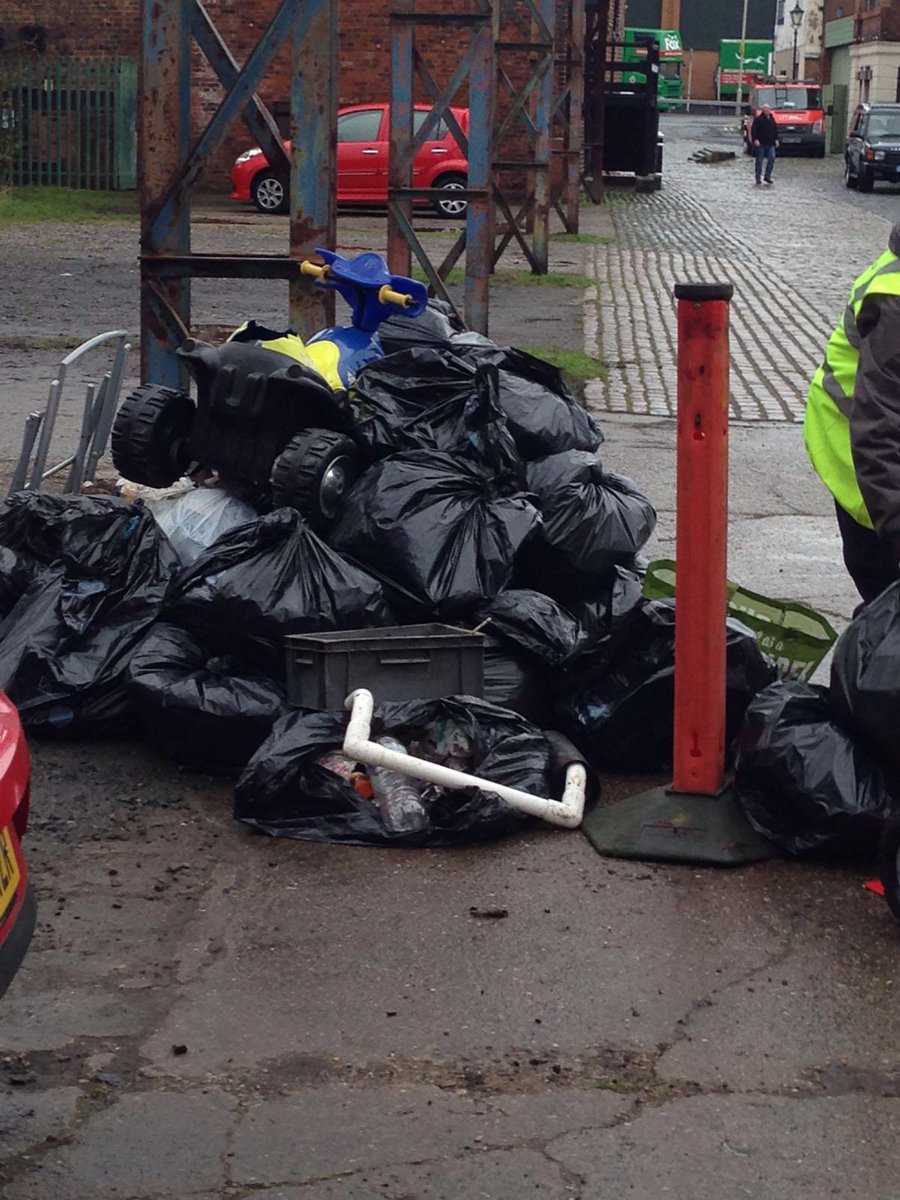 Dozens of bags of rubbish collected by volunteers. Amazing what people dump. Look at that kids bike!
