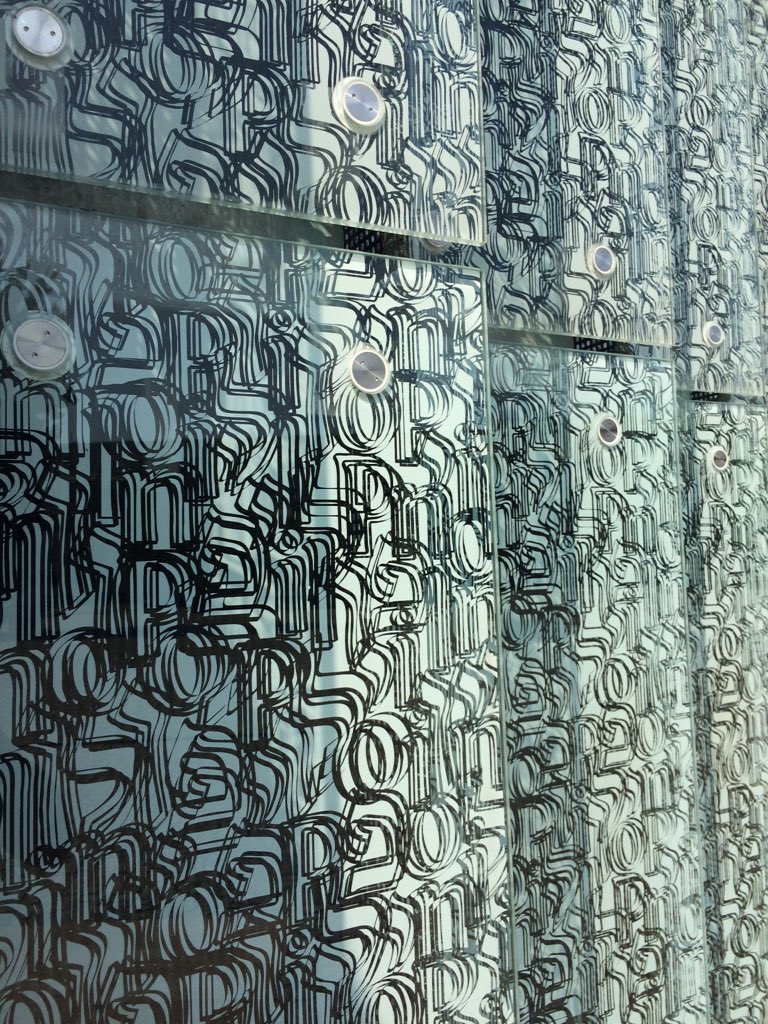 ytursha's tweet photo. Warsaw Jewish museum glass panels with pattern of overlapping Hebrew letters. #FontSunday #PublicArt @DesignMuseum https://t.co/J087Nn9Ivx