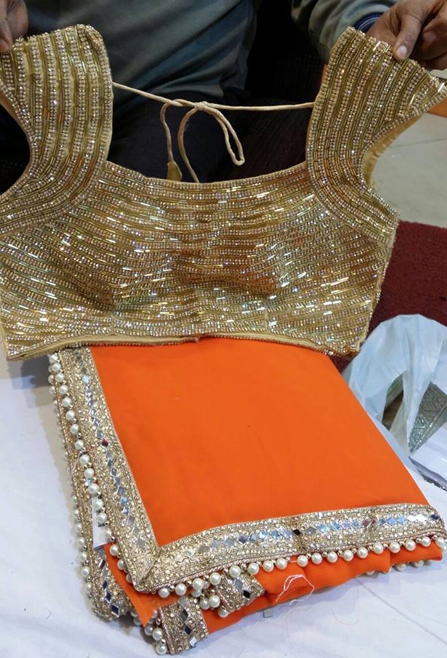 Pretty Saree with embellished mirror and pearl border with an elegant ready made blouse.     #Sarees #indianclothes