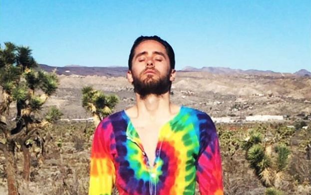 esquire's tweet photo. Why is Jared Leto wearing a tie-dyed onesie in the desert? An investigation: https://t.co/dgKodC5l6k https://t.co/AxrMqd6JF3