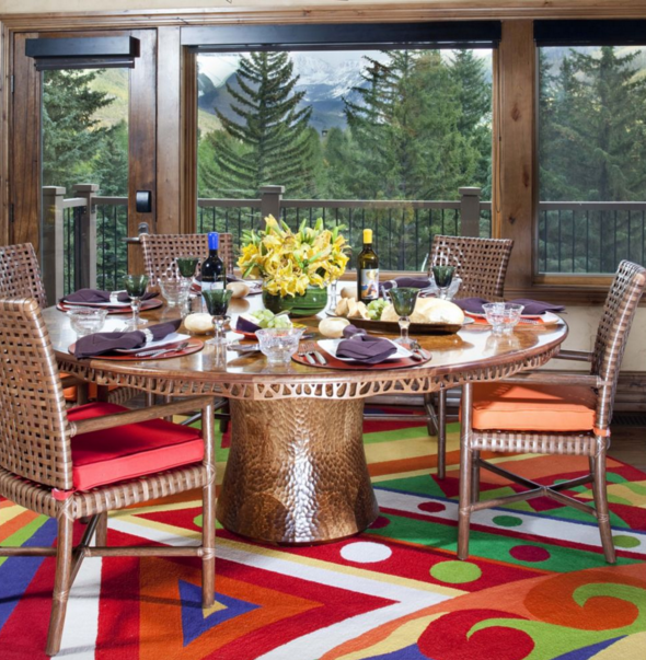 luxemagazine's tweet photo. A colorful rug packs a punch in this dining space completed by @CarolMooreCMID: https://t.co/x6UOIGZ7S9 https://t.co/AepGLNMWdQ