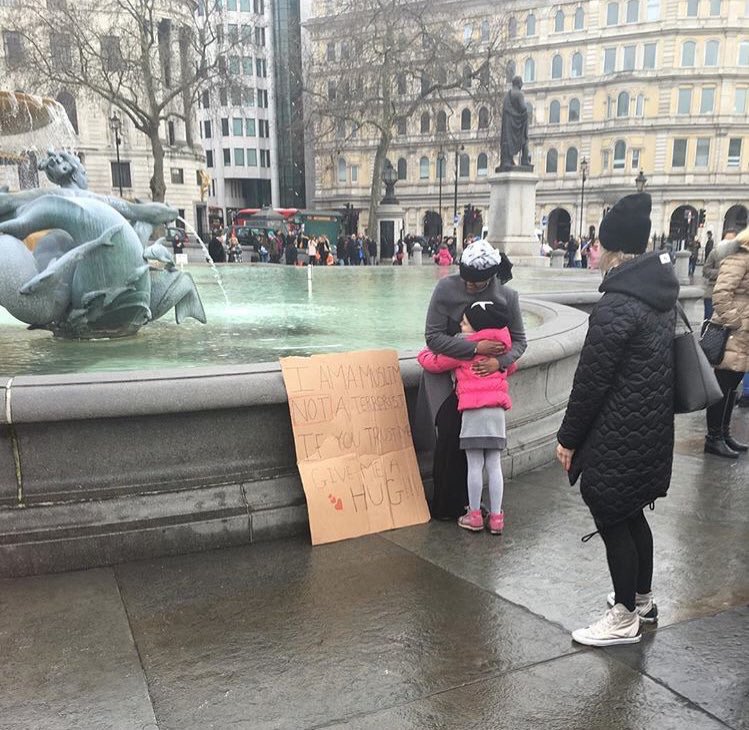 Jprz1321's tweet photo. A Muslim girl tells the people of London that she's not a terrorist and asks for a hug if they trust her https://t.co/oKbnJzYhMY