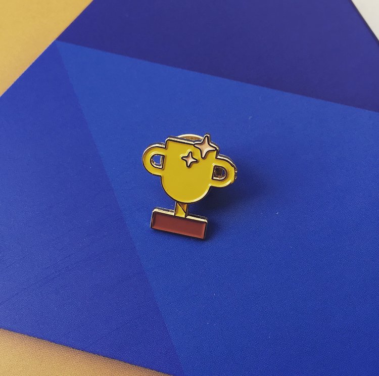 Thanks <a href="/GoogleDesign/">Google Design</a> for the New Year's care package! Seeing one of my icons as a metal pin was a nice surprise ✨