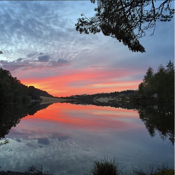 Cleawox Lake Florence OR Place of many gorgeous sunsets thx to photographer Johnny Barnett #traveloregon #realoregon