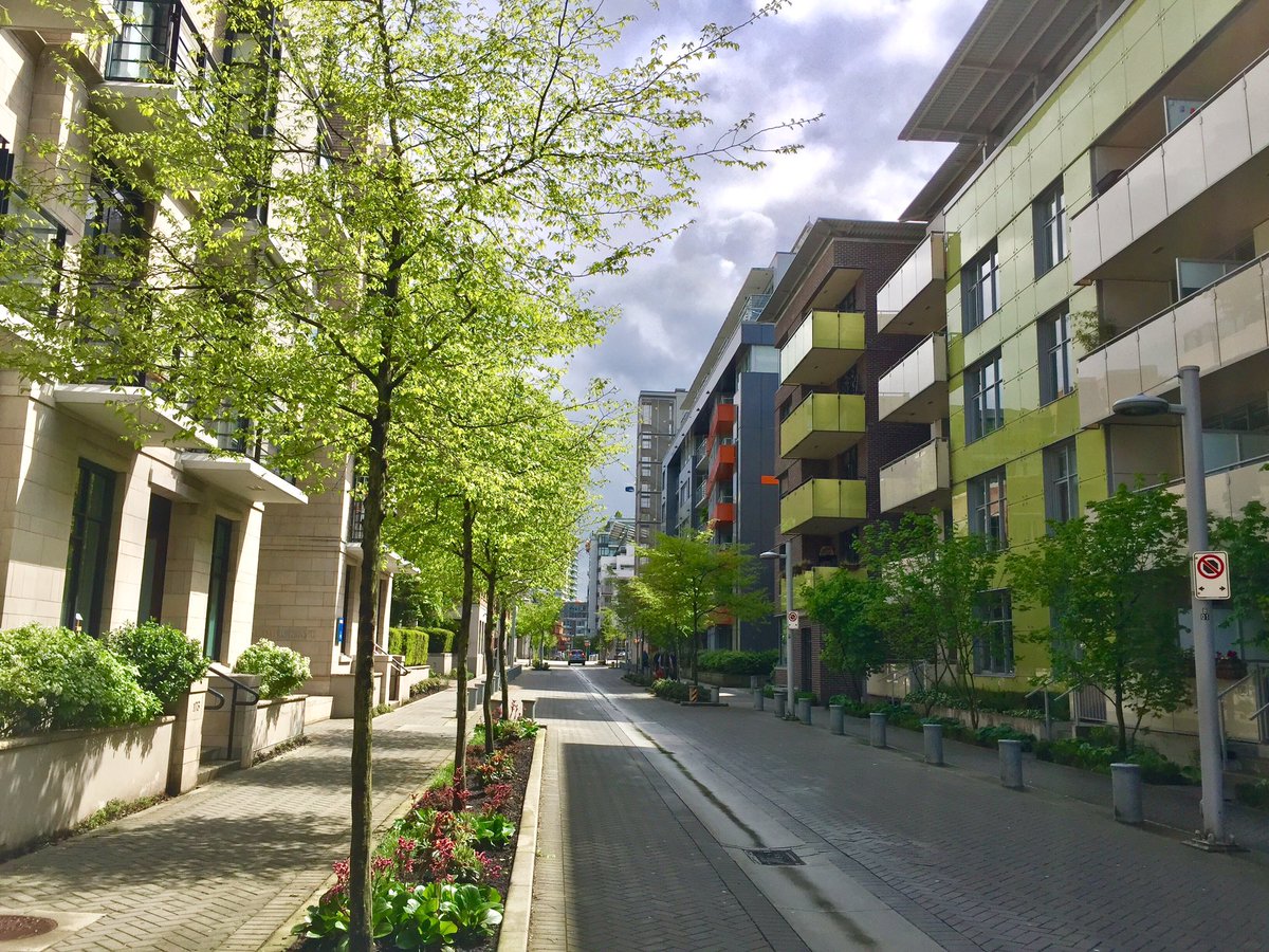 BrentToderian's tweet photo. A new model for street design in #Vancouver, #WalterHardwickWay in our #OlympicVillage. Slim right-of-way, no curbs, drainage in middle, etc https://t.co/giq1dt3GB7