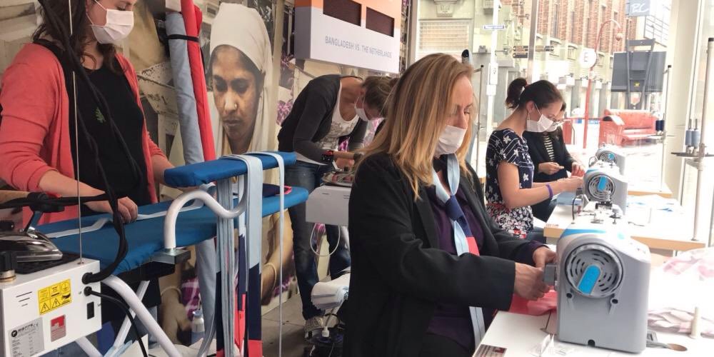 cleanclothes's tweet photo. Popup sweatshop in The Hague from our Dutch colleagues is live! #womenpowerfashion. First celebs spotted, stitching 2 support women workers! https://t.co/Ix5Zi85ypK