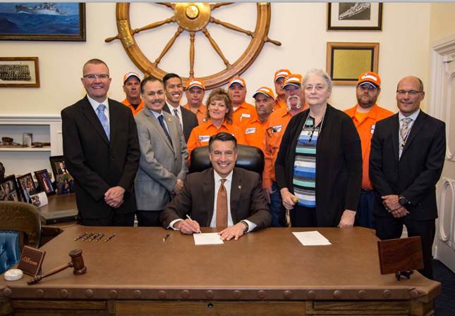 NDOTdirector's tweet photo. Thank you, Governor Sandoval for signing the "Move Over" bill, AB 17, to protect our workers! https://t.co/8SmzZMakqL