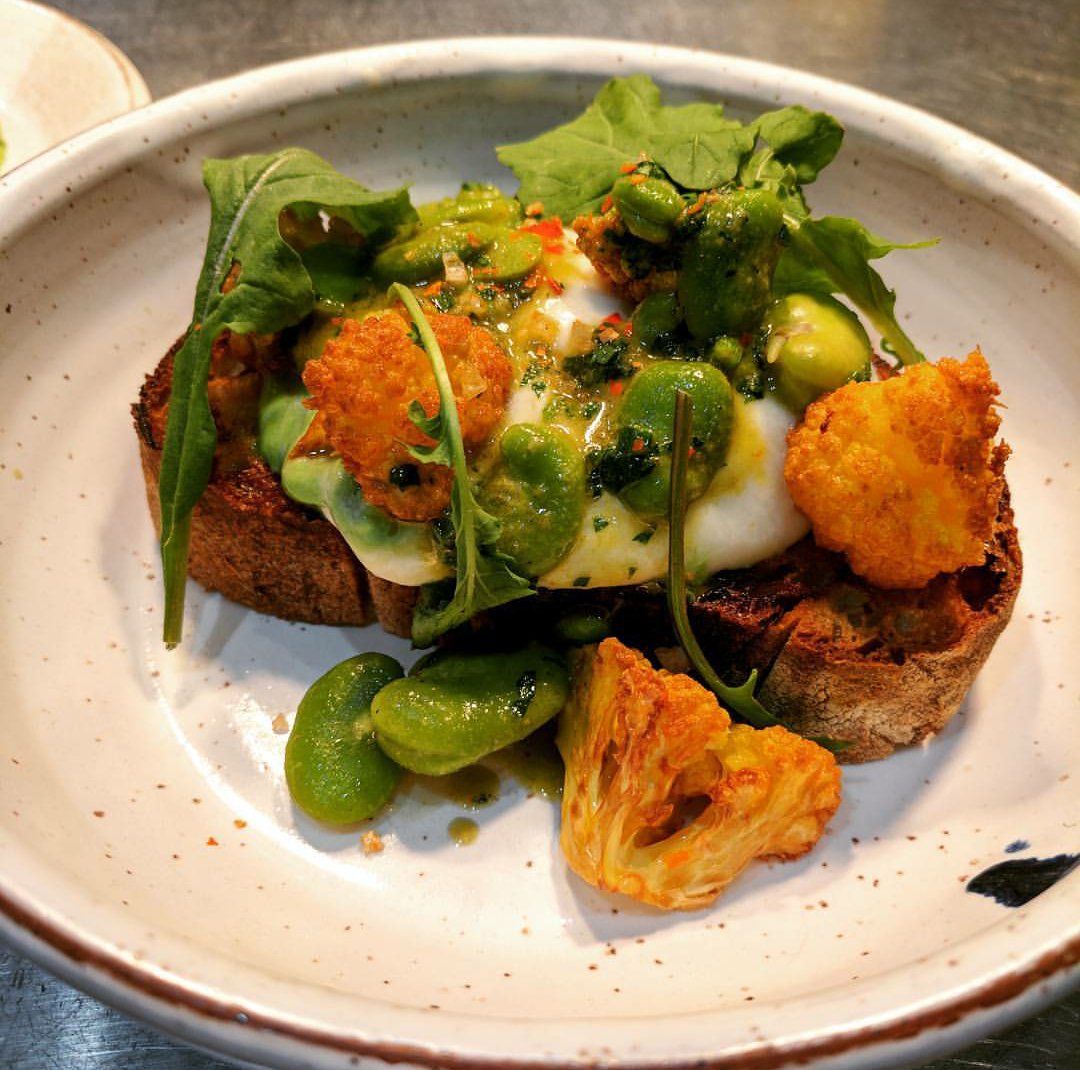 theanchoragegvl's tweet photo. New on the menu: Hand pulled ramp burrata w/fava beans, cheddar cauliflower on baguette. #eatlocal #yeahthatgreenville https://t.co/c0Rk4vRznX
