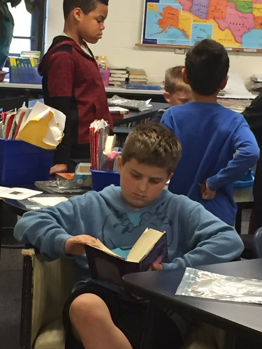 AlexanderReads's tweet photo. Carter and the end of a good book! Reading thru recess! #landofstories @chriscolfer @HoffmanTrailsEl https://t.co/lCvOIYQFg6