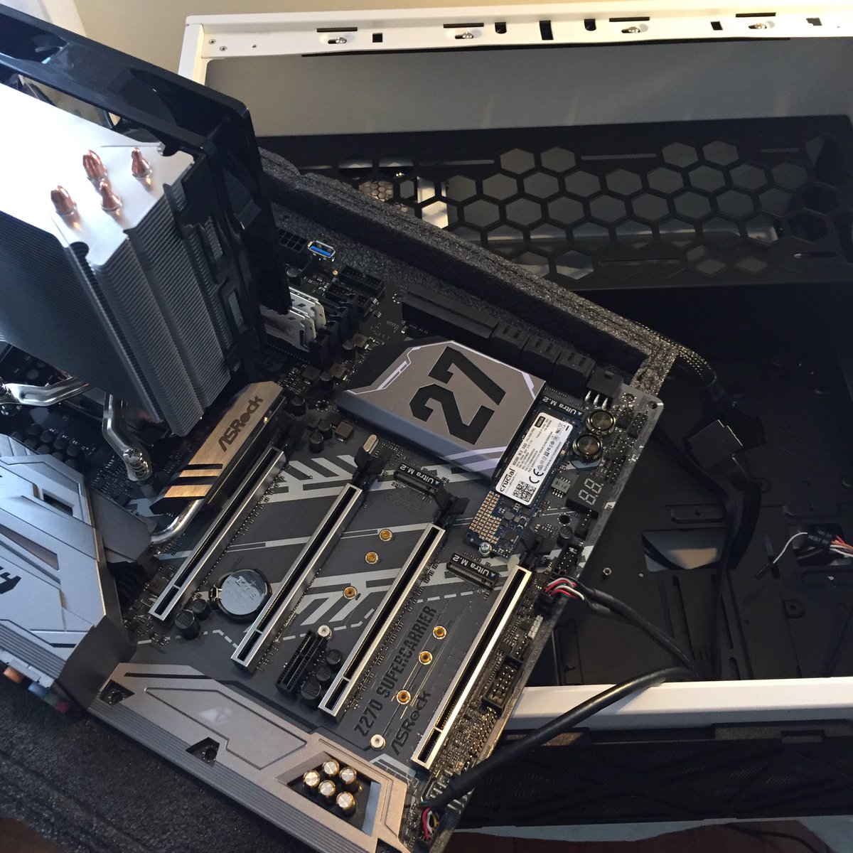 Elisabete's tweet photo. Still at it, folks. Pull out the mobo, unplugged the wires and started again. 

But this time, I've labeled ALL the things! 😅🔌🏷 #QuietPanic https://t.co/XVf3hdpr49