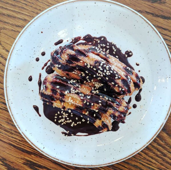 theanchoragegvl's tweet photo. One of our most popular desserts is back for First Friday: #Churros w/Mexican Chocolate Sauce &amp; Benne.  #yeahthatgreenville https://t.co/Tjd7PXVvfp