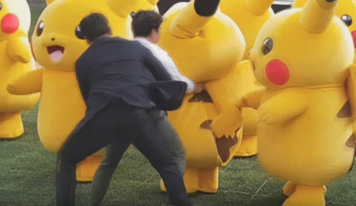GenePark's tweet photo. OK so the sweater guy got Pikachu,  2nd guy in suit was a bouncer who didn't know sweaterman was event staff, 3rd guy corrects him. Mayhem. https://t.co/VZiByWGIKo