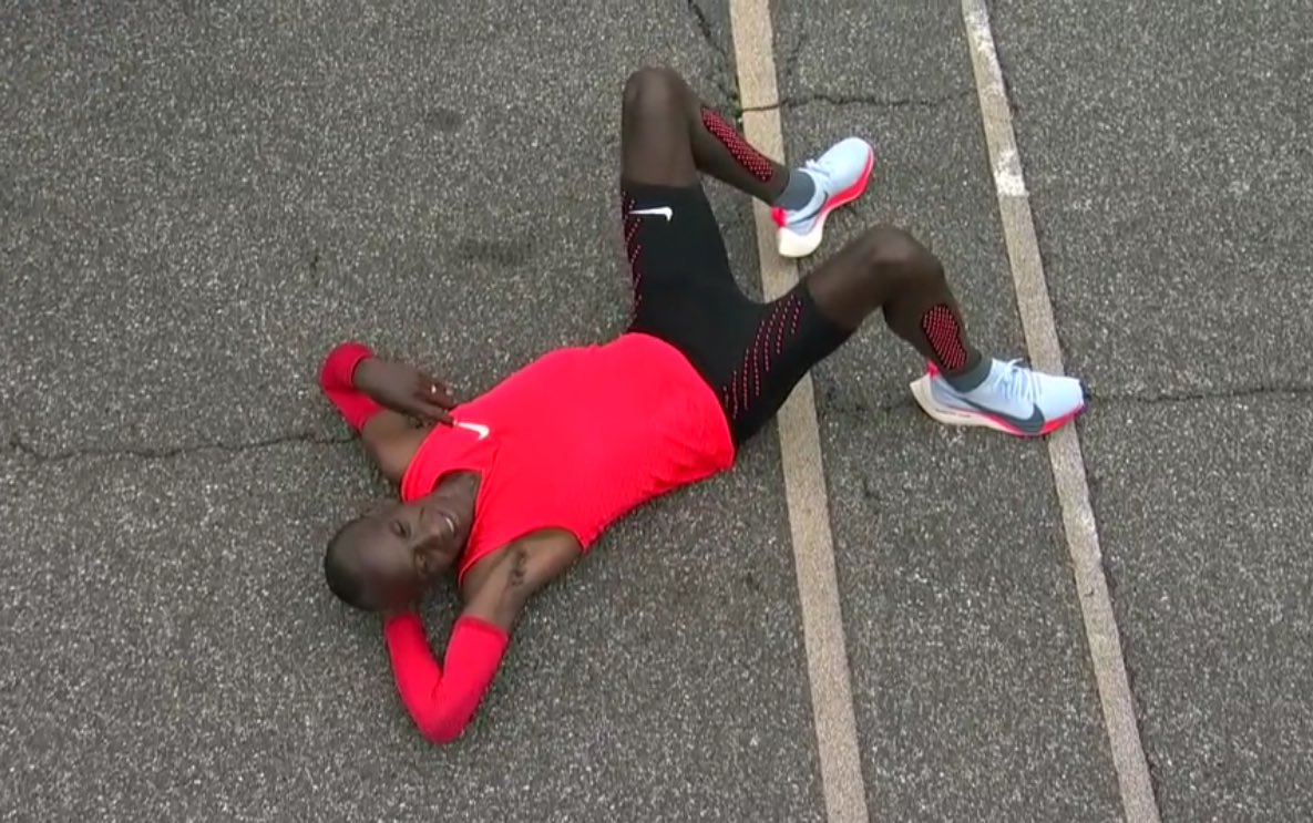 Eliud Kipchoge sprawled on track after 2 hours 25 secs marathon.