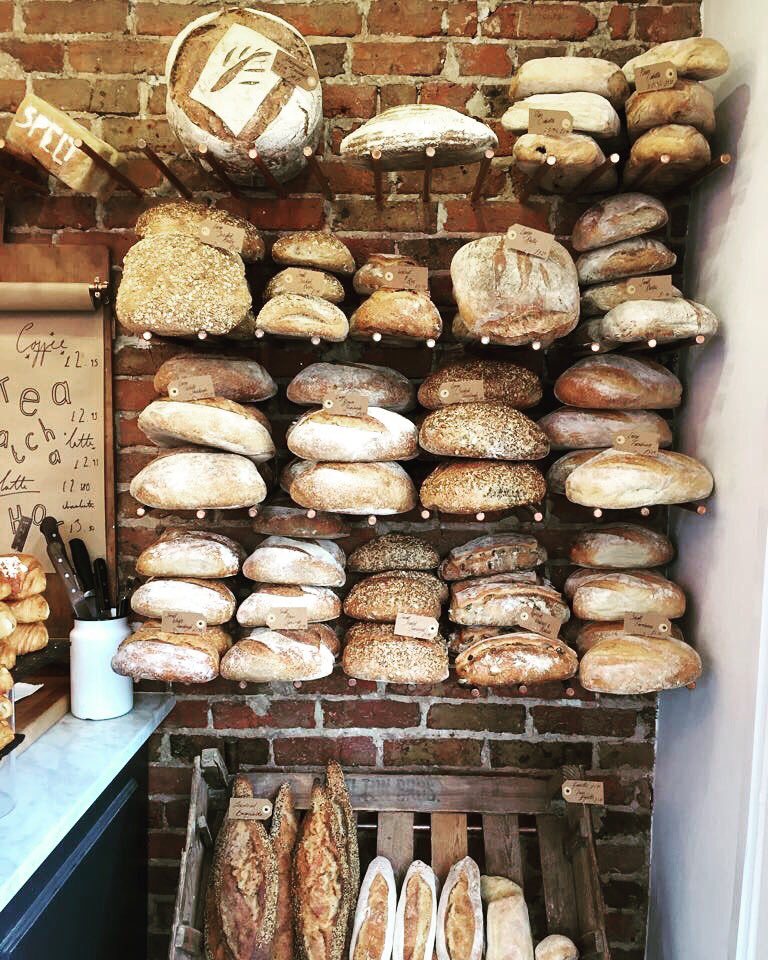 FlourPot_Bakery's tweet photo. It's #RealBreadWeek and we are kicking it off with a huge shelf full of our freshly baked loaves #flourpotbakery #sydneystreet https://t.co/6scMWj3gZ8