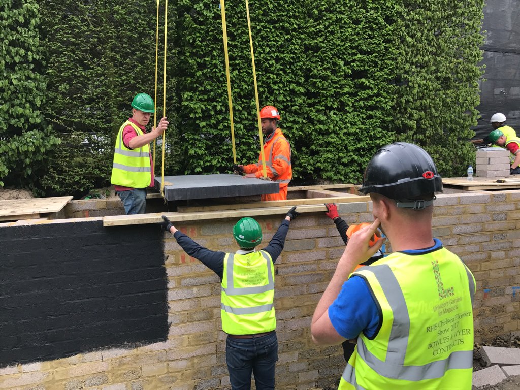 constructfilms's tweet photo. Building #RHSChelsea: first basalt concrete slab installed on the rear walkway on @LinklatersLLP Garden for @MaggiesCentres by @DHLandscapes https://t.co/goFJLSLWc2