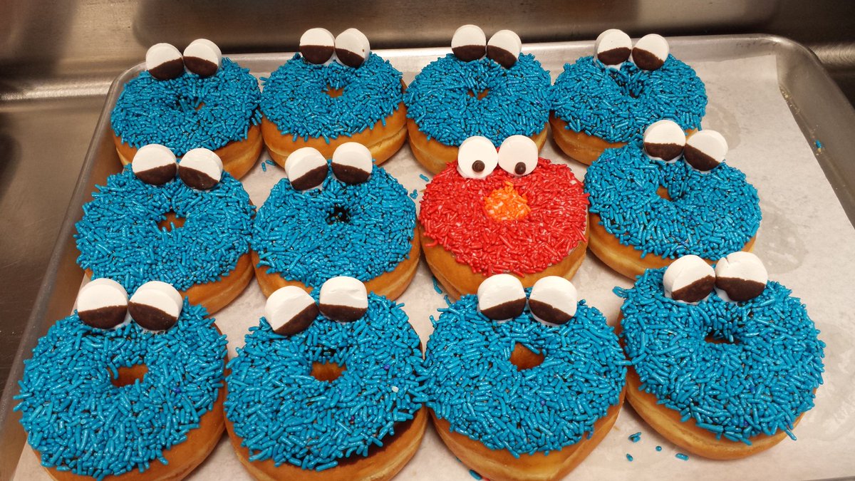 One of these things is not like the other  #elmo #cookiemonster @thedonutstation #donutsarefun