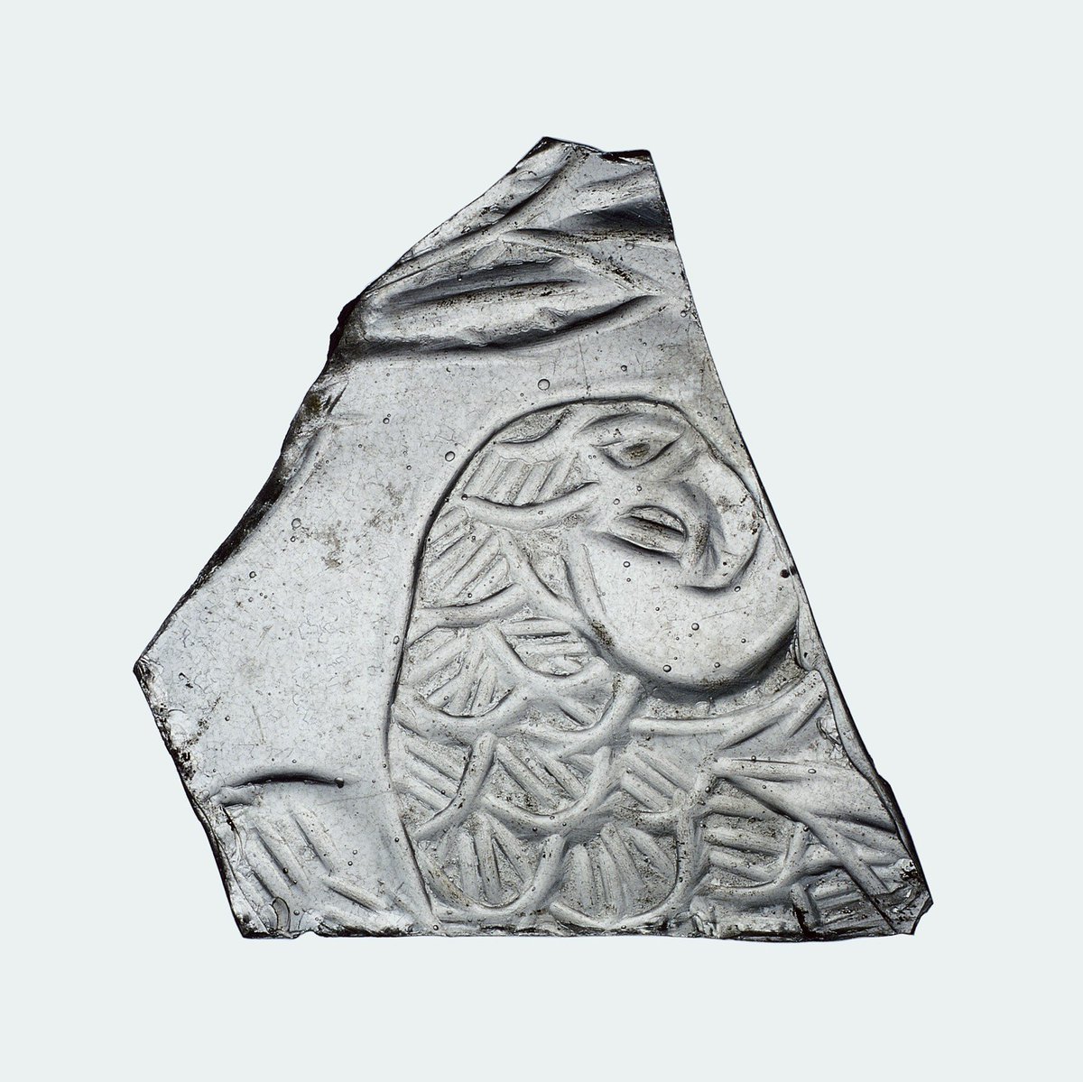 archleblanc's tweet photo. Relief cut eagle on glass frag from @corningmuseum; date is unclear, could be Roman-Islamic, but prob 3rd/4th c.CE (https://t.co/wHFwe9Q5Ii) https://t.co/G81MlYUbYy
