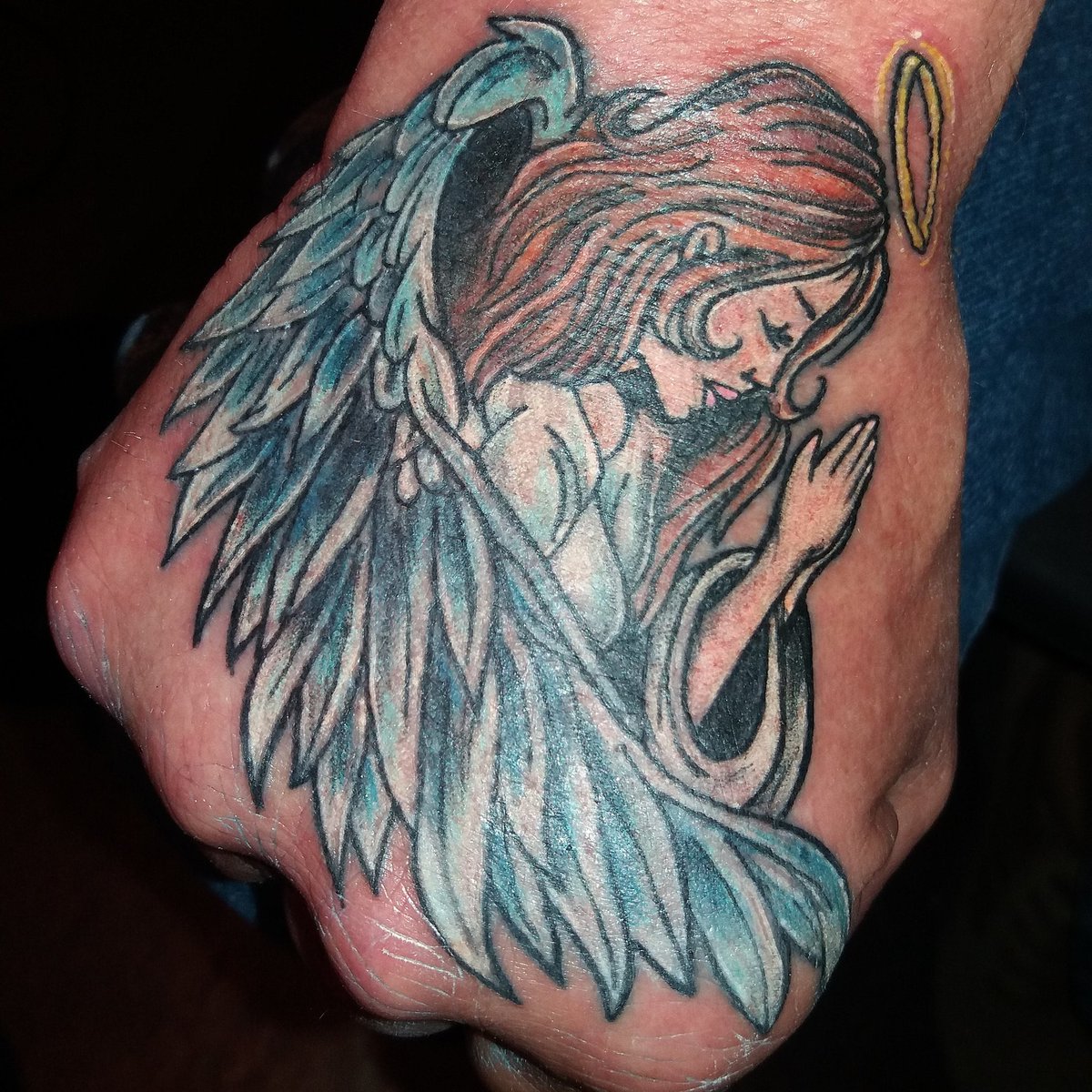 devastation79's tweet photo. #angles #angeltattoos #handtattoos #colortattoos #tattoossavedmylife had fun doing this one https://t.co/1CD6Qy59MW