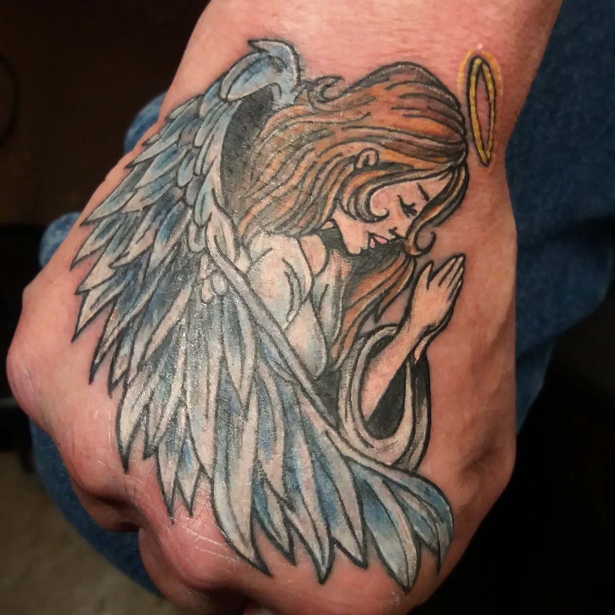 devastation79's tweet photo. #angles #angeltattoos #handtattoos #colortattoos #tattoossavedmylife had fun doing this one https://t.co/1CD6Qy59MW