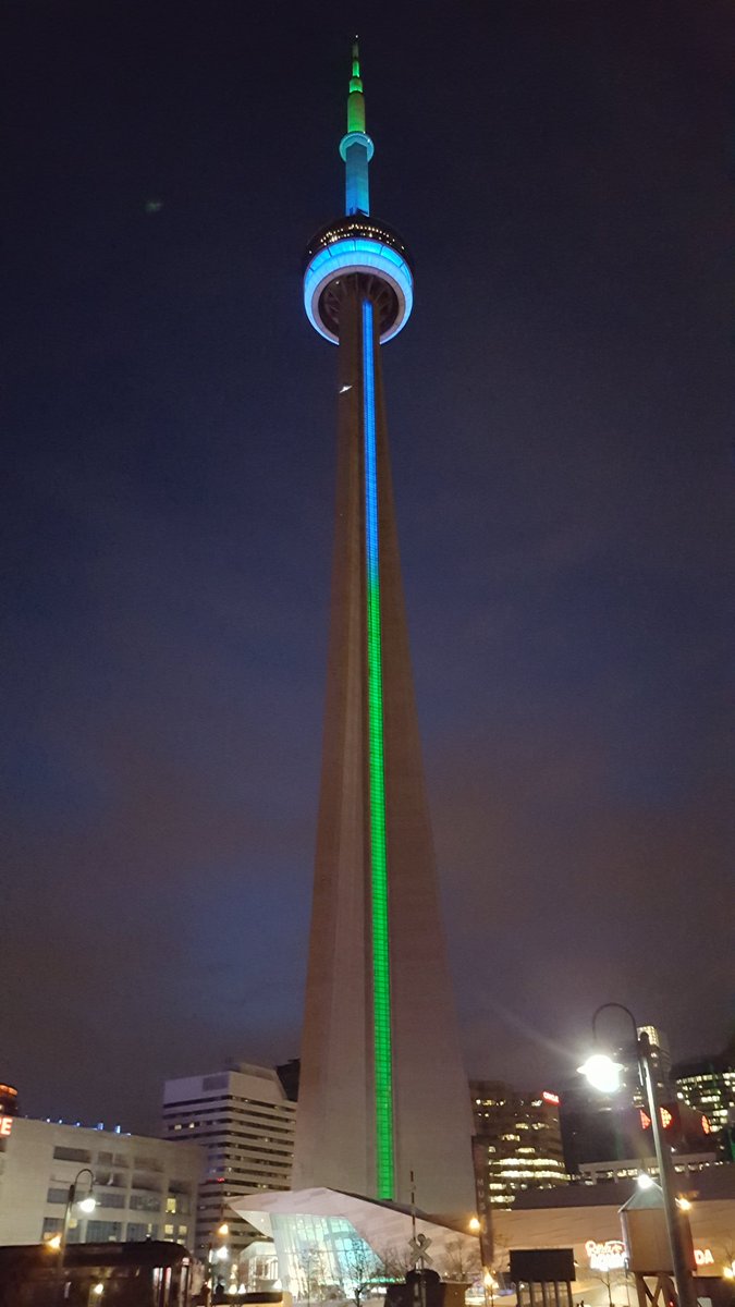 InclusionCA's tweet photo. One of Canada’s most iconic landmarks goes blue &amp; green for community living! #CLmonth17 #ShineALightOnCL https://t.co/w6SaxKHmnF