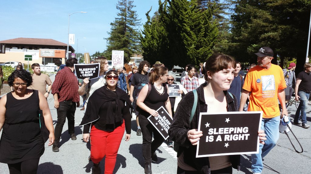 scimc's tweet photo. Over 60 people hit the streets against greedy landlords, petty politicians, anti-homeless architecture and vindictive cops. #FreedomSleepers https://t.co/O2gldHwk0G