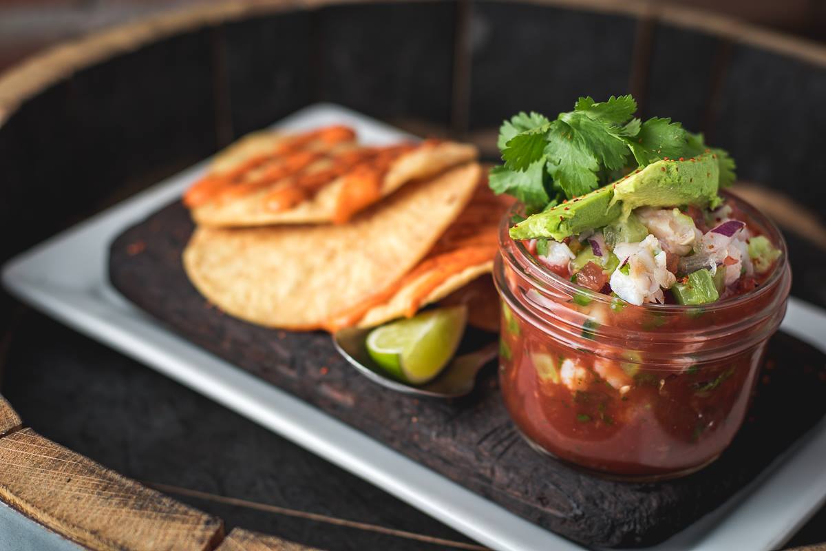 Our Shrimp Ceviche is marinated in lemon, cucumber, onion, cilantro, avocado, &amp; tomato jalapeno Sangrita. Served w/ tostadas and spicy mayo.