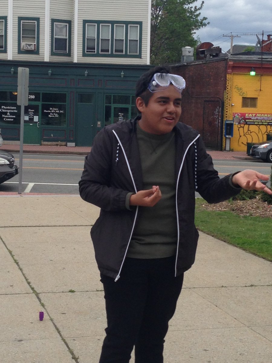 Teen intern Eder demonstrates the science of  "r-candy" or "rocket-candy" at Knight Memorial's YA science experiment program! @provcomlib