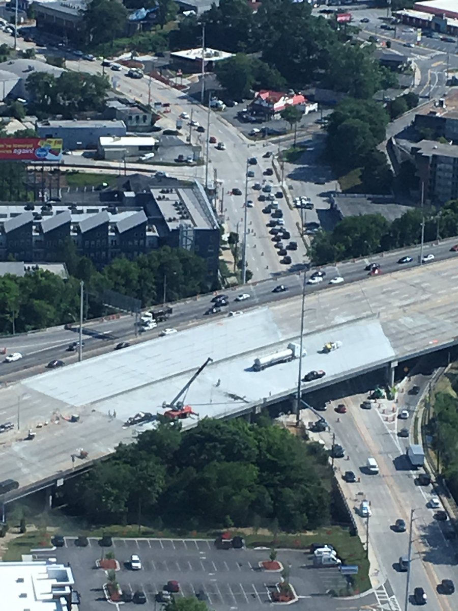 DougTurnbull's tweet photo. Just since yesterday, southbound striping has begun and the center wall finished. #85bridgecollapse #ATLtraffic https://t.co/NQJBkHfjBQ
