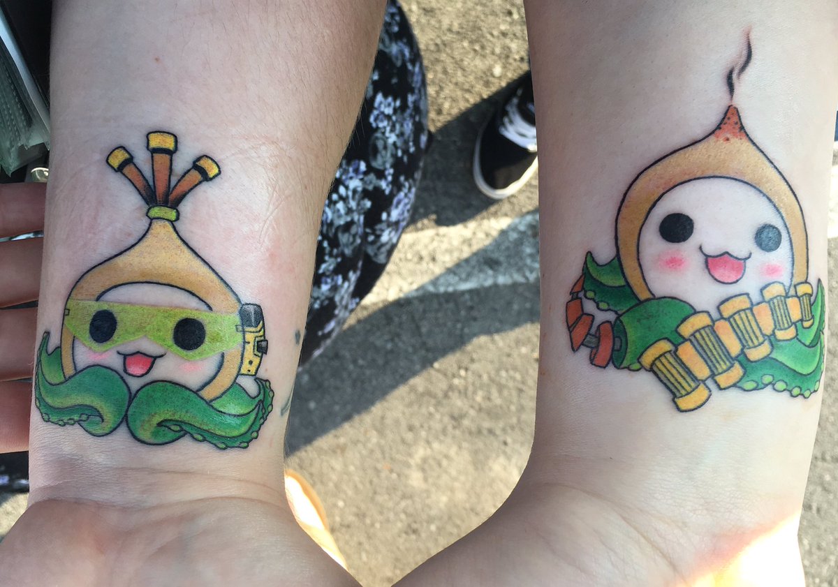 ToshiWash's tweet photo. My best friend and I got these matching tattoos today! Thank you @PlayOverwatch for bringing us closer together #Overwatch https://t.co/1FtB6UOmAa