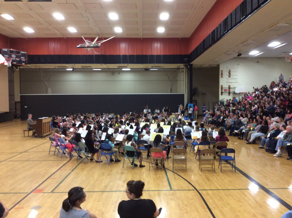 PrincipalTTT's tweet photo. Mrs. Pim leads the 5th grade orchestra students in the New World Symphony.  Osseo strings rock! https://t.co/doI8PoZZbk