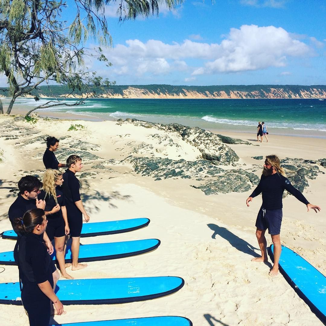 sunshinecoastoz's tweet photo. A lesson on 🏄🏼 with the rainbow sands in the background. @visit_gympie, you beauty!😍  Pic: @epicOadventures #VisitSunshineCoast @queensland https://t.co/0KKswVWHqM