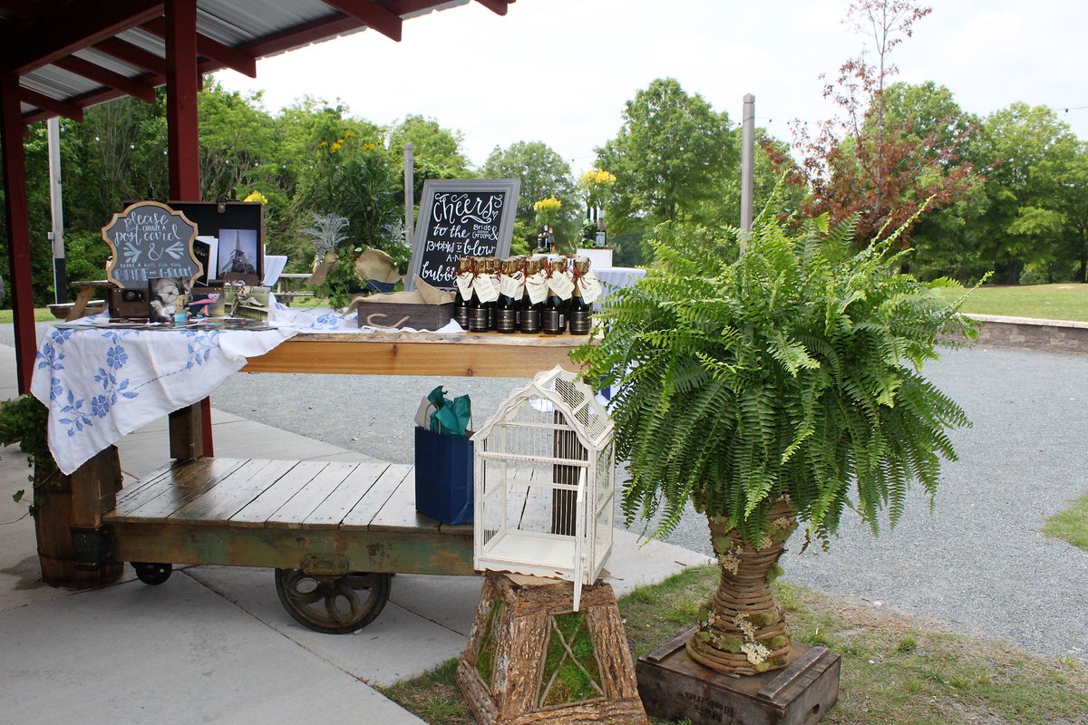 What a cute gift &amp; favor table provided by Just Dandy Designs for Sandy's wedding at The Field Trial Barn! #rusticdecor
