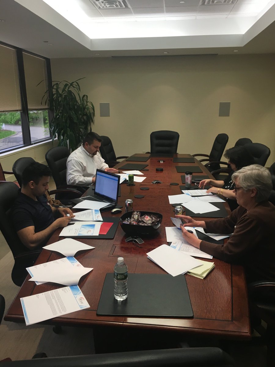 Vinny and Saif working with a client.