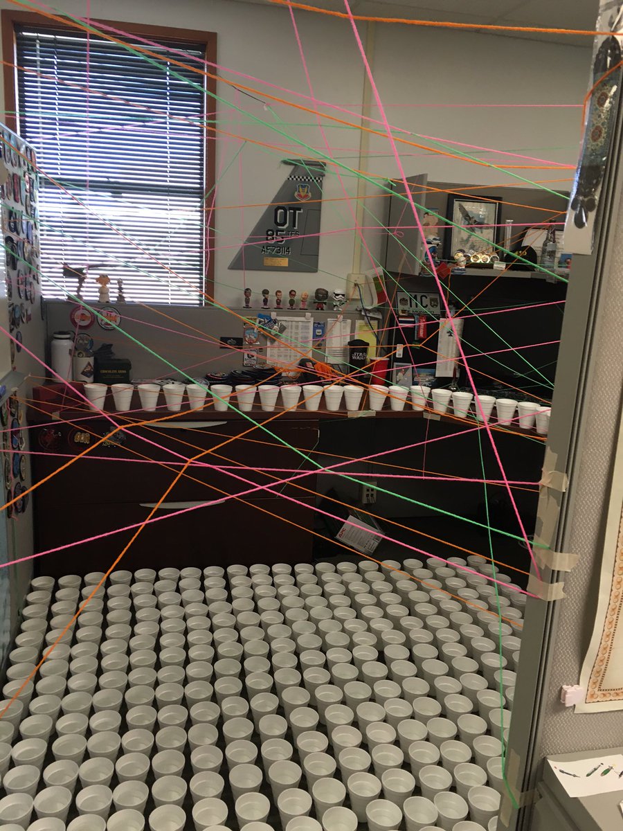 This is how the people at work prepped a coworker's cubicle for his return!  Yes, cups are full of water
