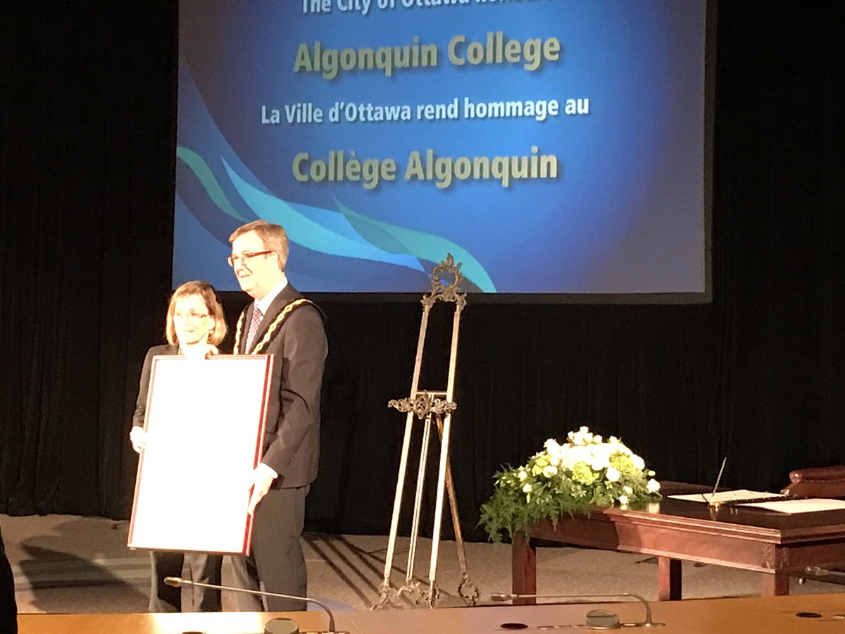 Cheryl Jensen receiving the keys to the City of Ottawa from Mayor Watson on behalf of Algonquin College!!