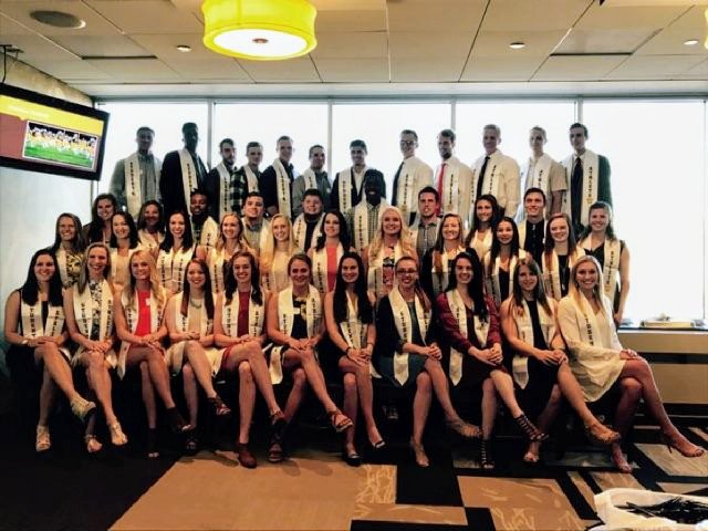 Presenting our graduating student-athletes with their stole courtesy of the <a href="/CowboyJoeClub/">Cowboy Joe Club</a>'s W Club. Congrats! #GoWyo