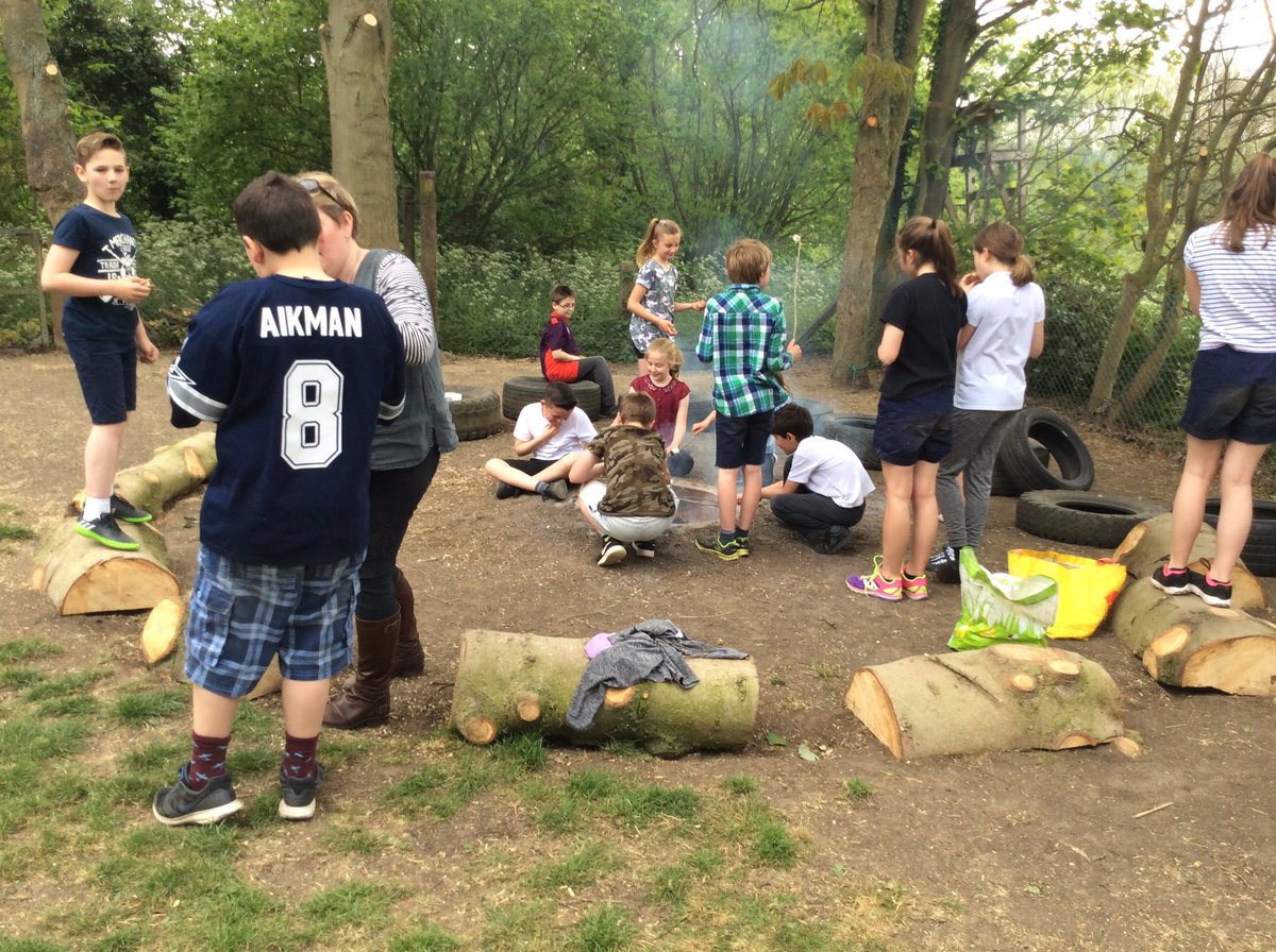 SATS have finished-the Year 6s unwind over a marshmallow roasted over a fire. Well done to you all!