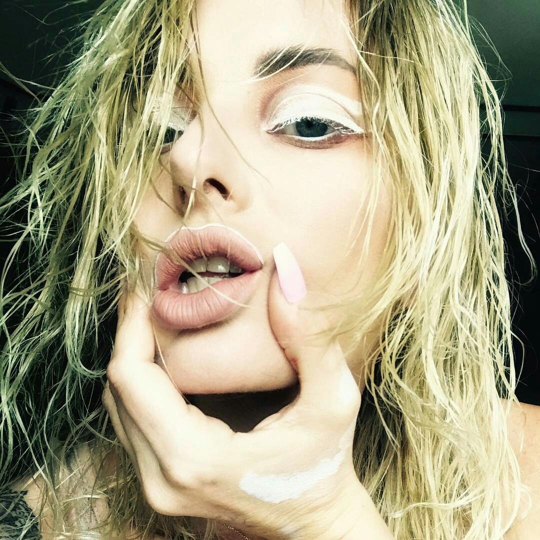 It lifts me up and then
          It bites me with soft lips
Your mouth, your mouth....