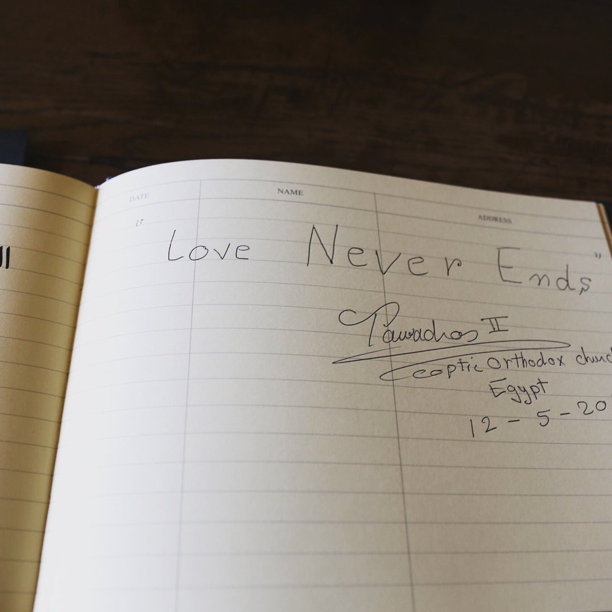 ArchbishopSarah's tweet photo. Three words: "Love never ends" - message by #Coptic @PopeTawadros in the @LambethPalace visitor book today. https://t.co/eoBnmNcIhy