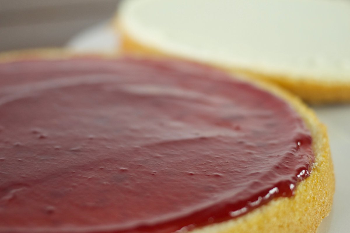 CakeAcademyBake's tweet photo. T'riffic, tantalising, tangy #jam on a freshly #baked soft #sponge #cake, ready to finish with some hand decoration and off to a customer https://t.co/Z9QapELTXz