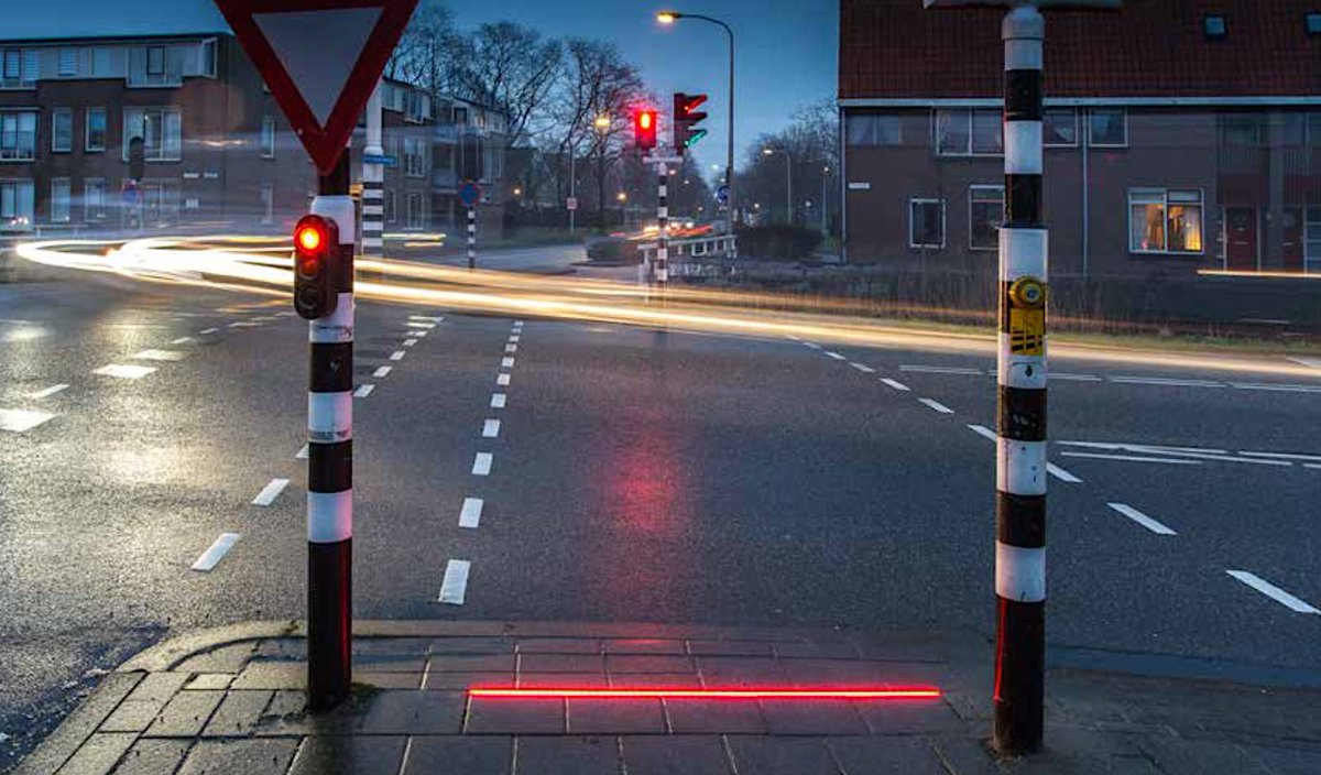 wef's tweet photo. This Dutch town has traffic lights on the ground because people are staring at their phones https://t.co/dXXu4RQHBl #technology https://t.co/27lv9Qn8gp