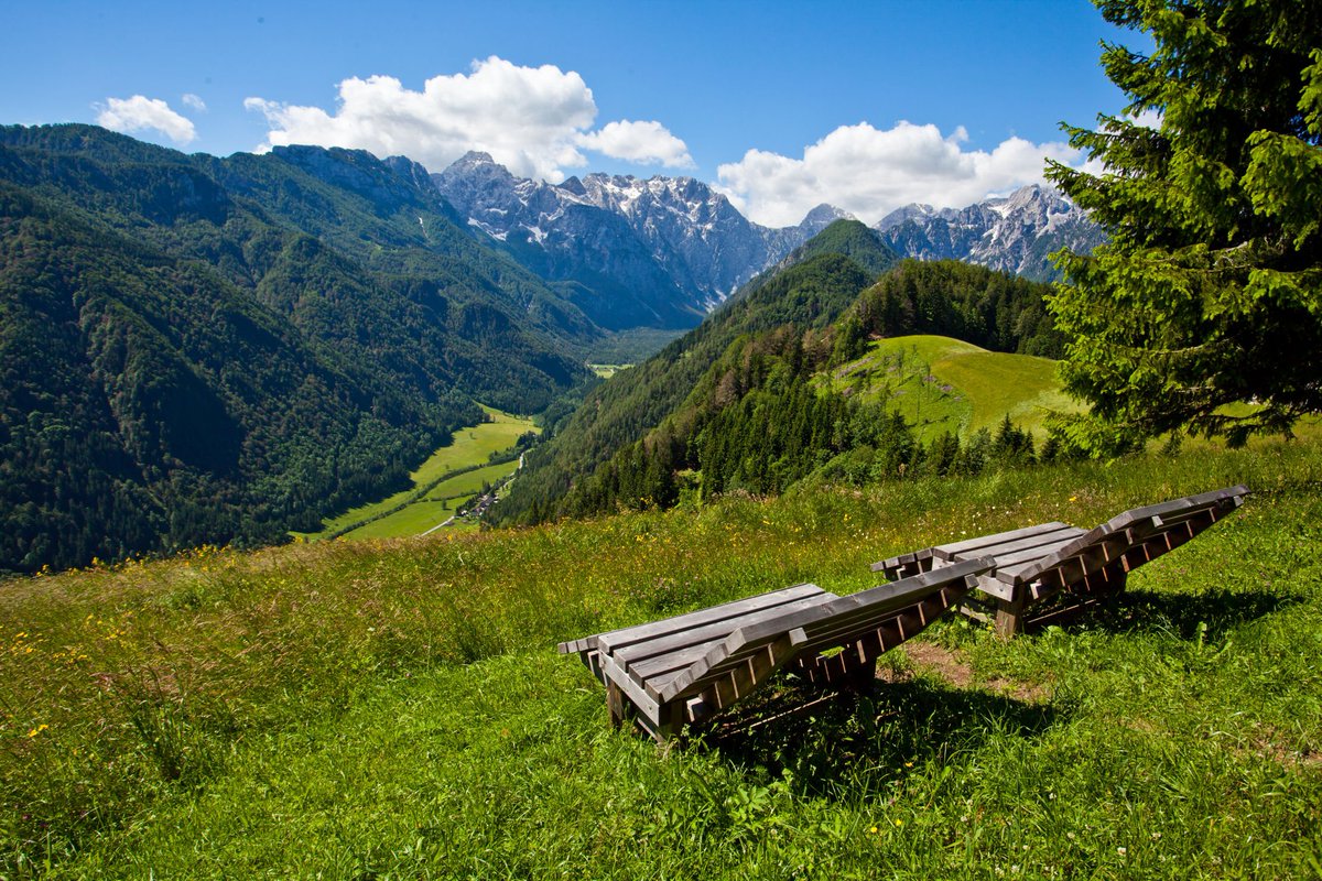 travel_slovenia's tweet photo. LOGARSKA VALLEY, #Slovenia - wooden benches with a great view of the #Logarska valley, which is one of the most beautiful valleys in #Europe https://t.co/lweOWhOghx