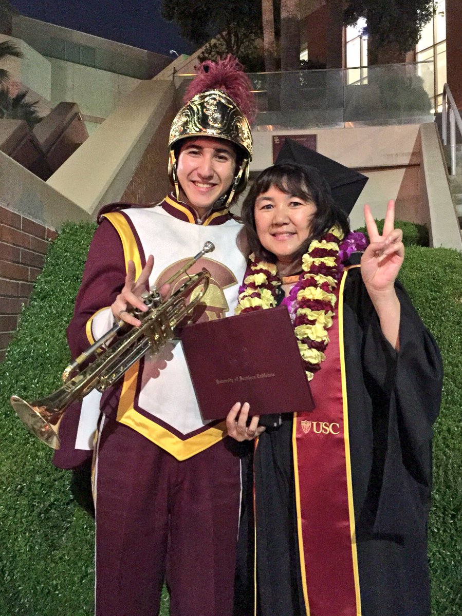 USCTMB's tweet photo. #OnlyAtUSC can two bandsmen perform for their moms as they graduate with MBA's from @USCMarshall. #FightOn Cheryl & Jake and Ryan & Vivian! https://t.co/oTzet9ii8W