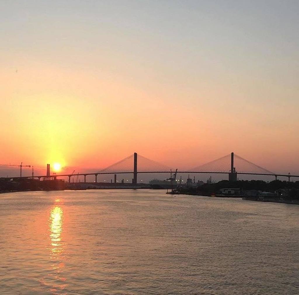 VisitSavannah's tweet photo. Tangerine sunset over the Talmadge Bridge. #VisitSavannah [📸: @chamagne_d] https://t.co/0K9SyHclHP https://t.co/PudQTeRUjo