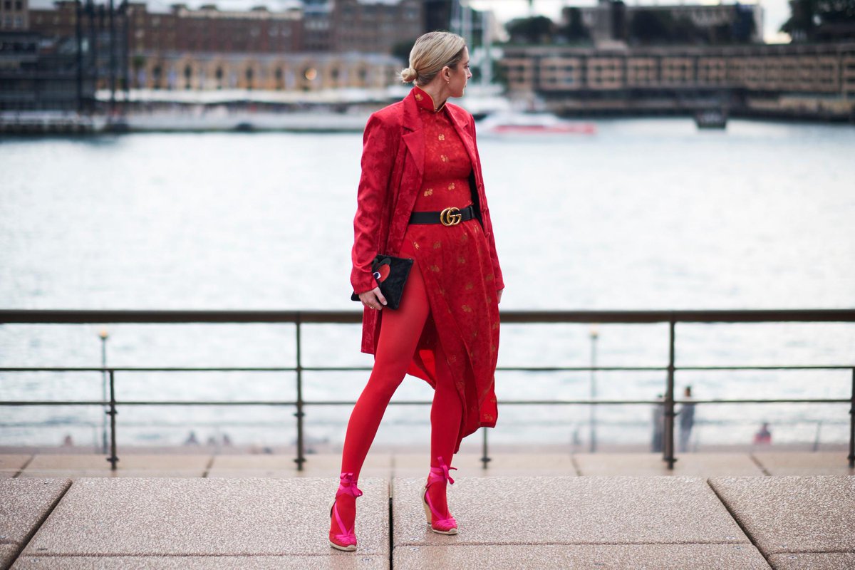 FashionWeek's tweet photo. Street Style: Ladies in red took over the Sydney Opera House steps on day one of @FashionWeekAus. #MBFWA #FashionWeek https://t.co/cFDphxrt6l