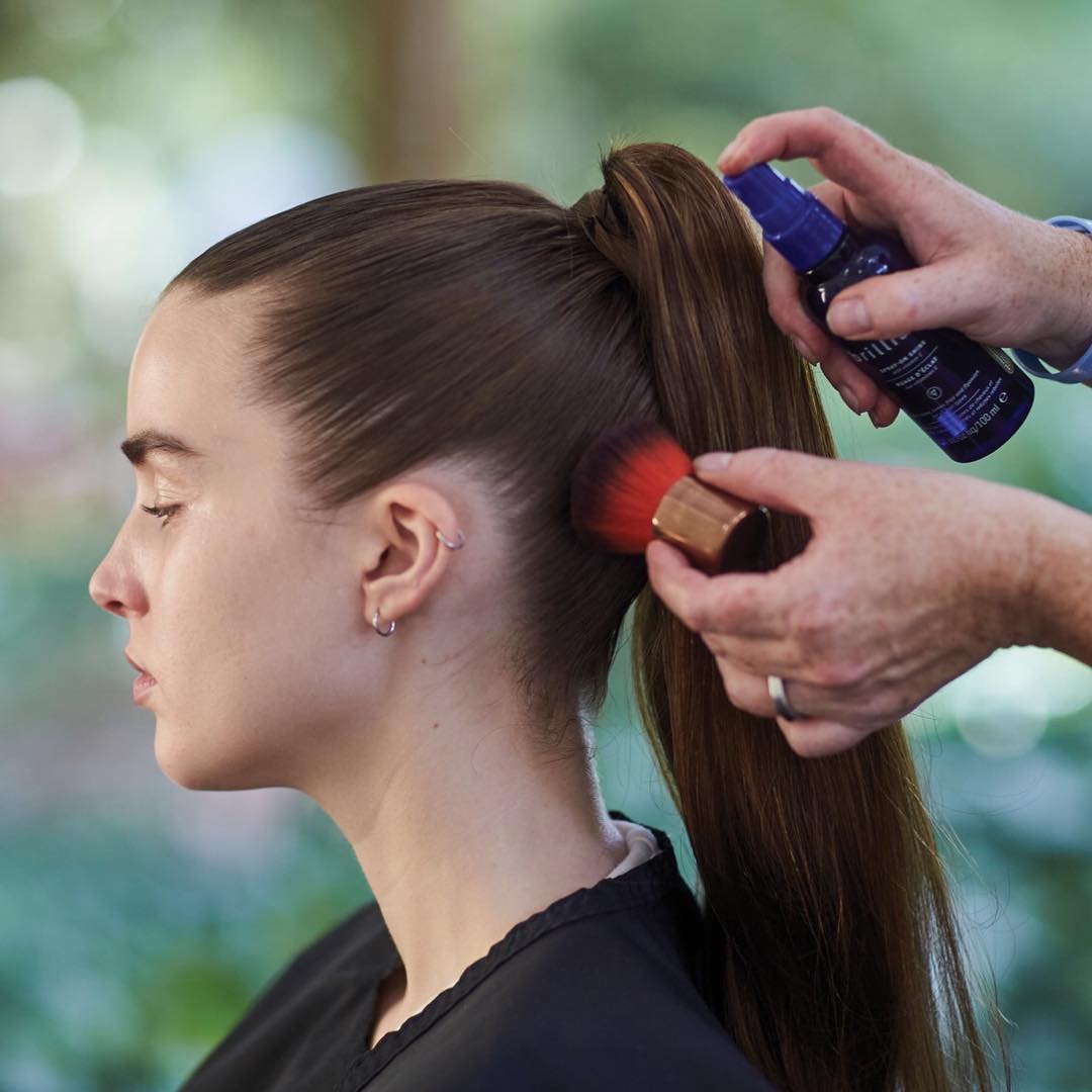 Create a perfectly polished ponytail with Aveda Brilliant Spray-on Shine. #HaircareTip